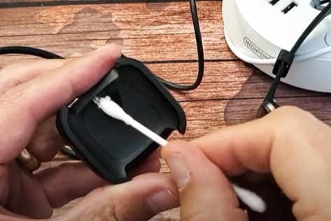 Fix a Fitbit Versa Won't Turn On Clean the Charging Connections Prongs and Contacts